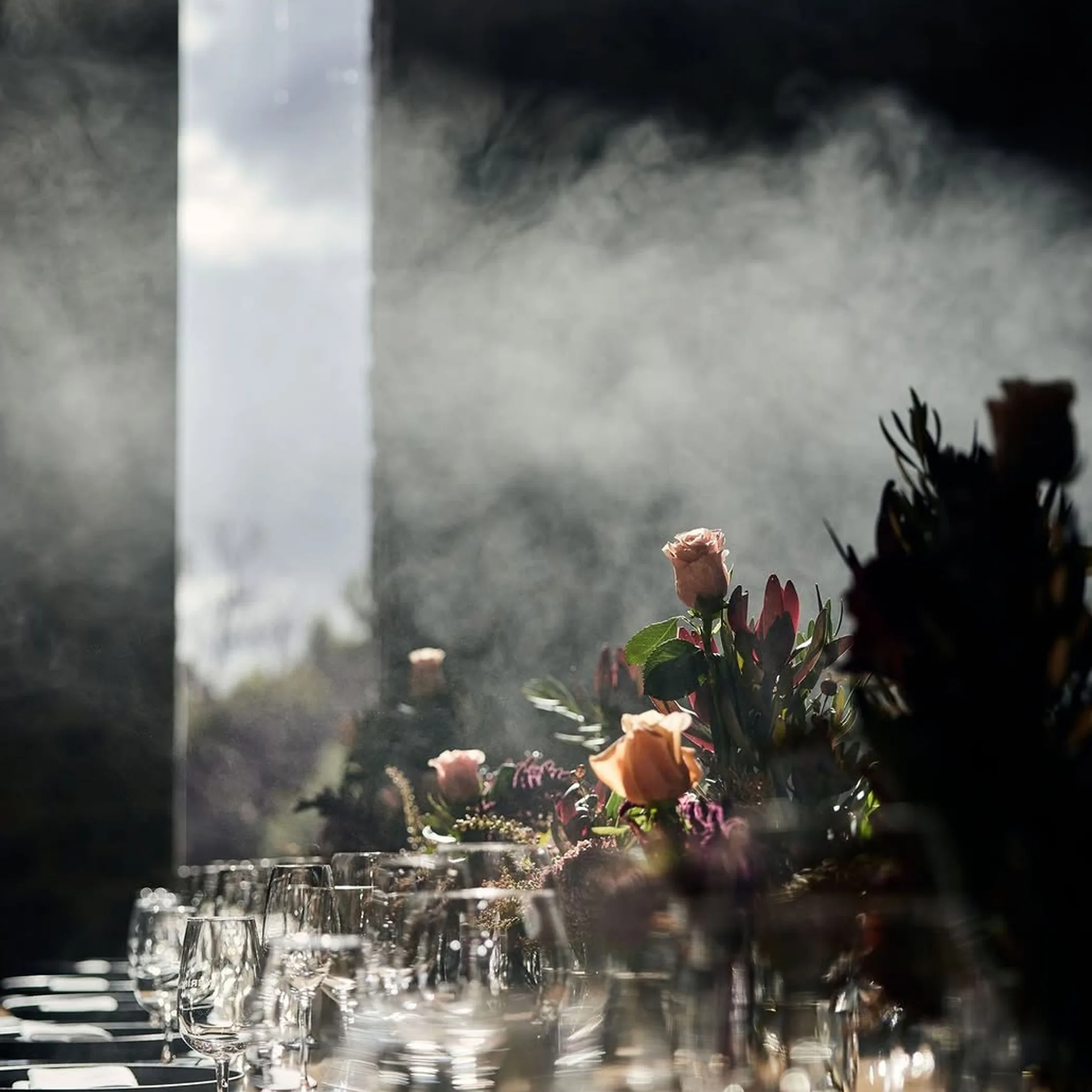 dining with seasonal flowers and wine glasses